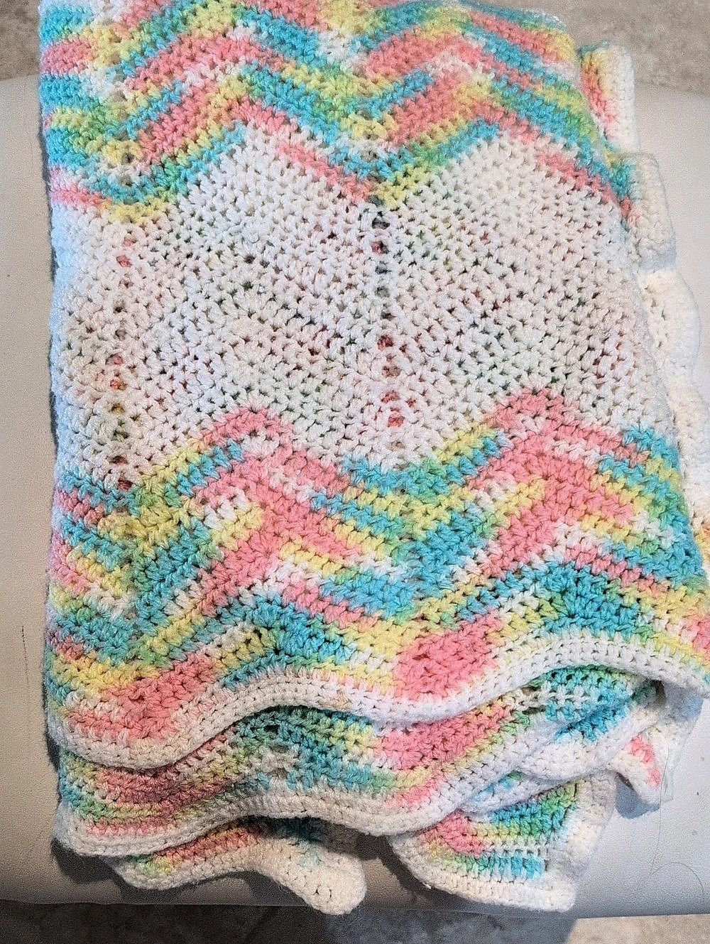 Crocheted White,Pink,And Blue Childs Blanket